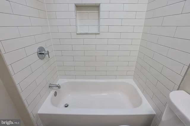 a close up of a bathtub in a bathroom