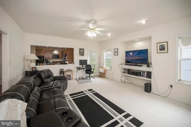 a large kitchen with a table and chairs