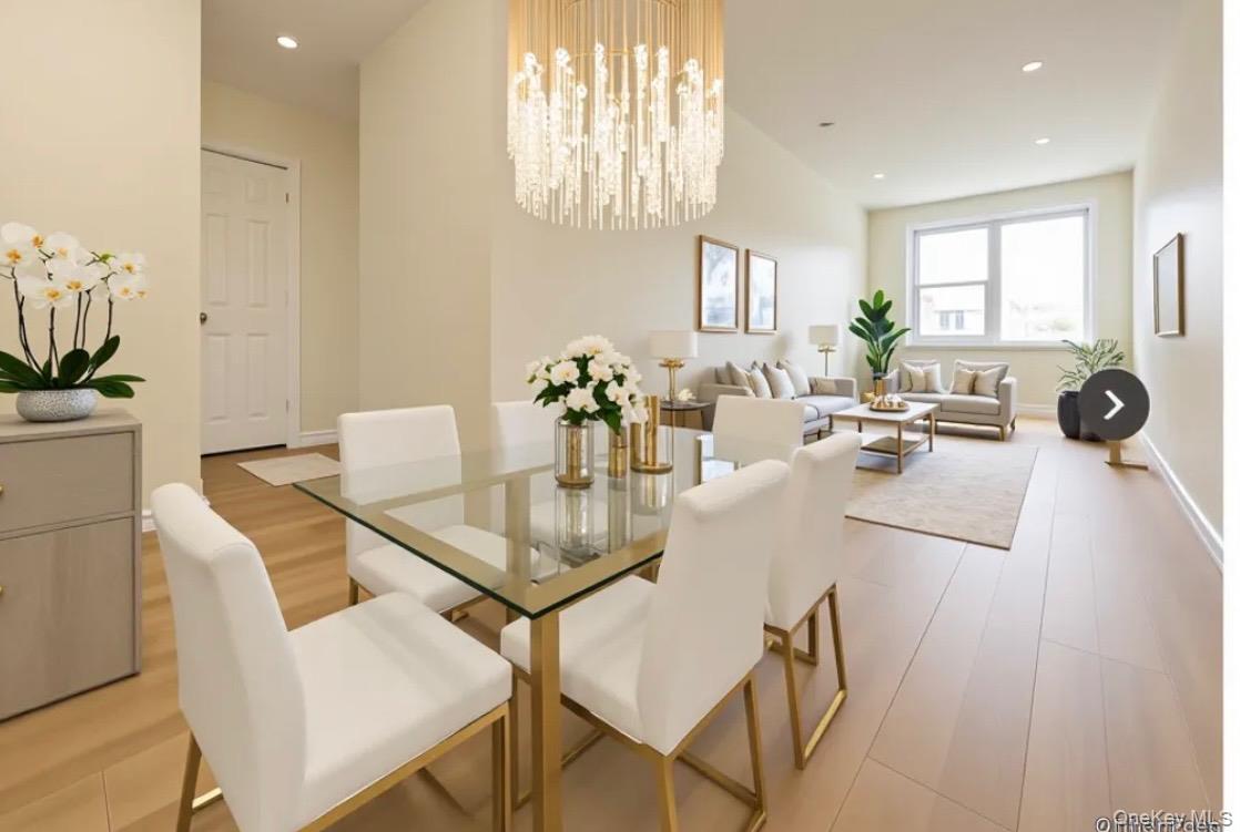 172-70 Highland Avenue, Unit 8P Queens, NY 11432 - Photo 10 of 11 a view of a dining room with furniture and wooden floor