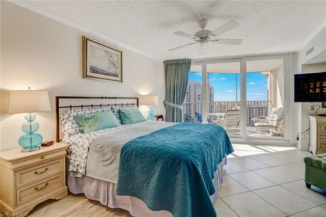 a bed room with a bed and a television