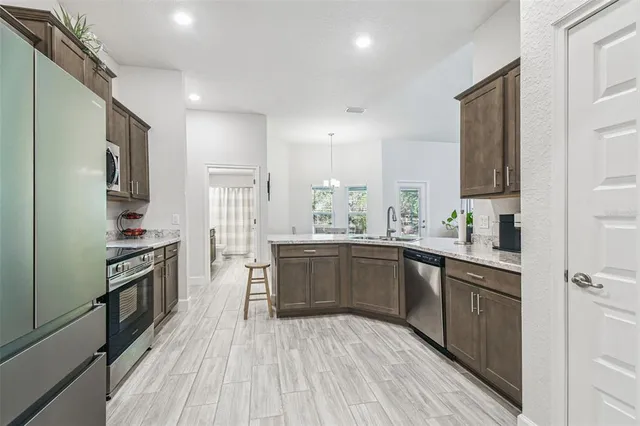 a kitchen with sink and window