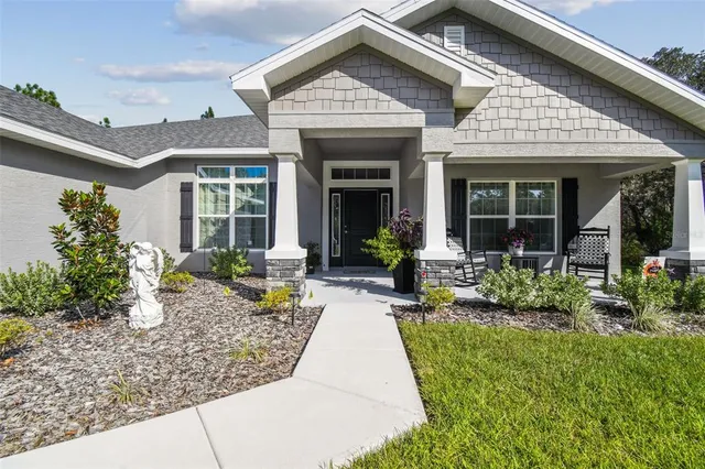 a view of a chairs and table in patio