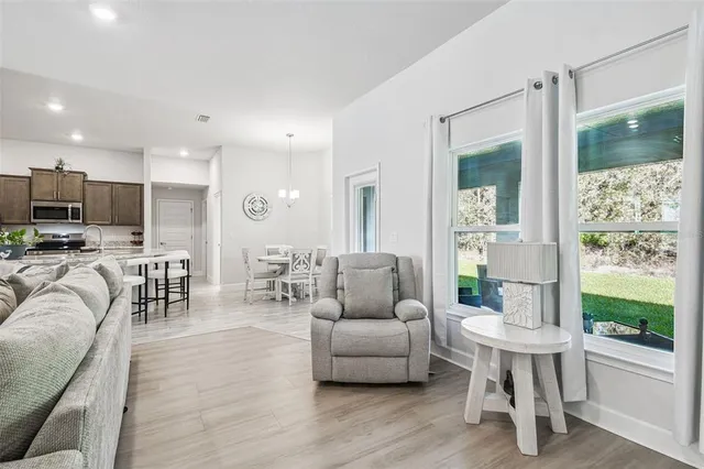 a bathroom with a granite countertop sink a toilet a shower and a mirror