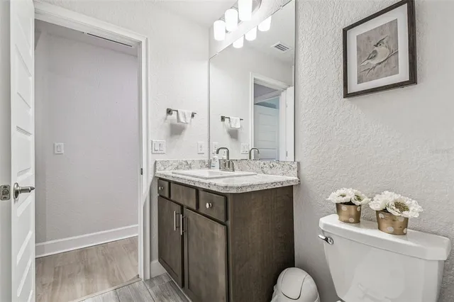 a view of kitchen and bathroom with a sink