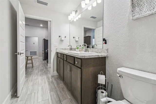 a bedroom with a bed and a television