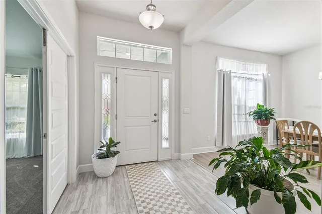 a view of entryway with wooden floor