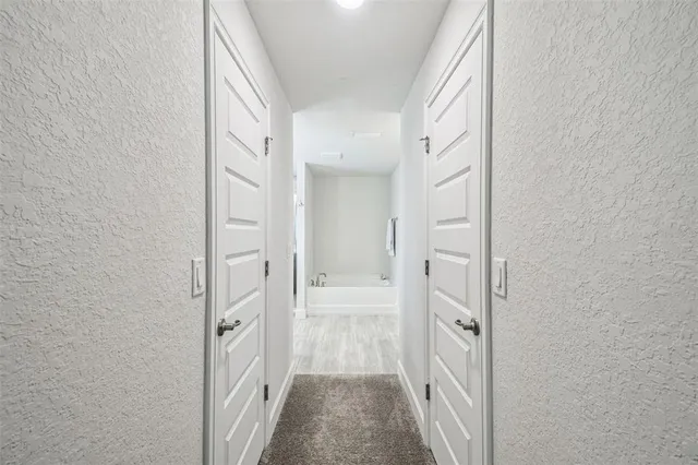 a bathroom with a granite countertop bathtub sink and toilet