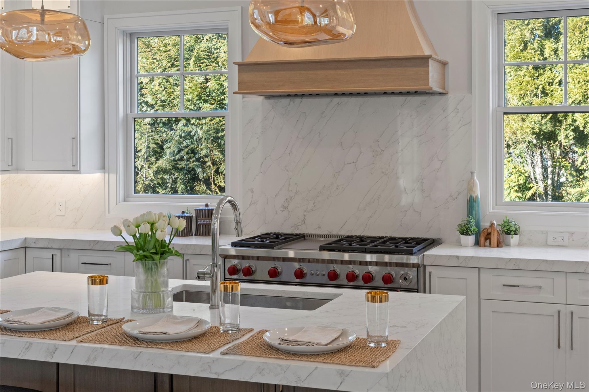 2590 Cox Neck Road Mattituck, NY 11952 - Photo 17 of 50 Professional grade appliances and refined finishes elevate the kitchen into a true culinary centerpiece designed for both function and style
