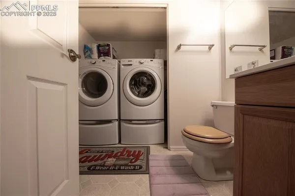 a bathroom with a toilet and a sink
