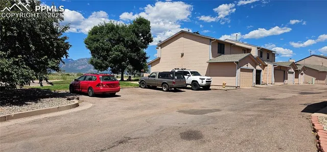 a view of a car park in front of house