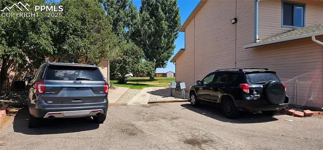 a view of a car in front of house