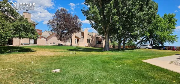 a view of a house with a big yard