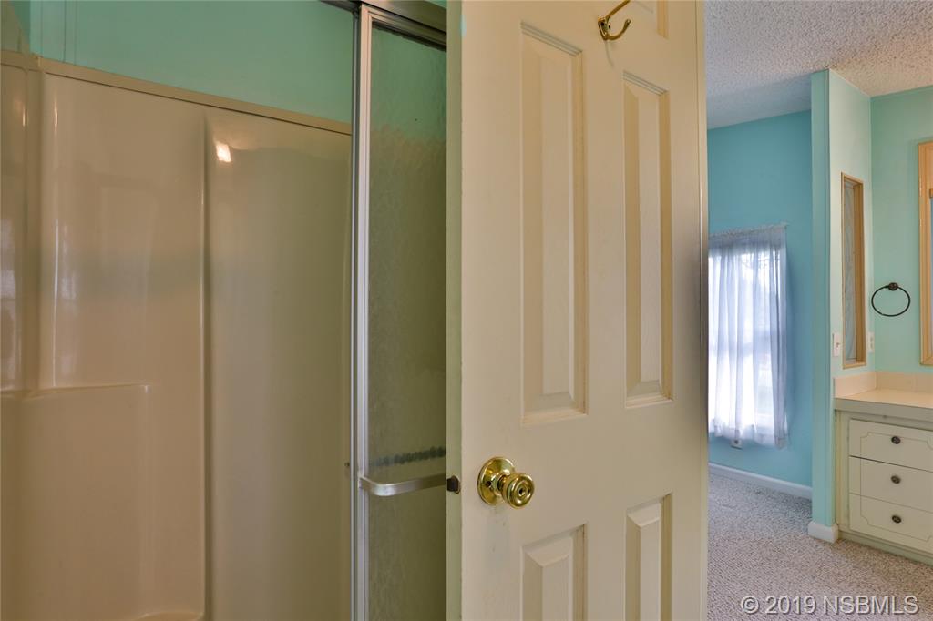 720 Navigators Way Edgewater, FL 32141 - Photo 21 of 35 a bathroom with a shower