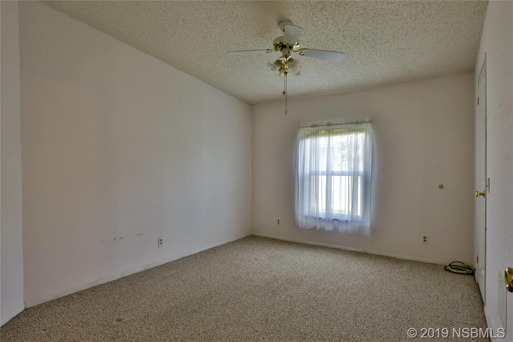 720 Navigators Way Edgewater, FL 32141 - Photo 22 of 35 an empty room with a window