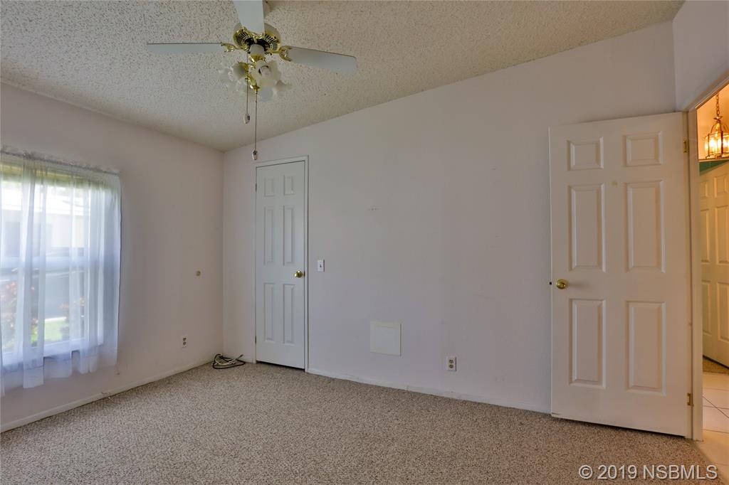 720 Navigators Way Edgewater, FL 32141 - Photo 23 of 35 a view of an empty room with a window