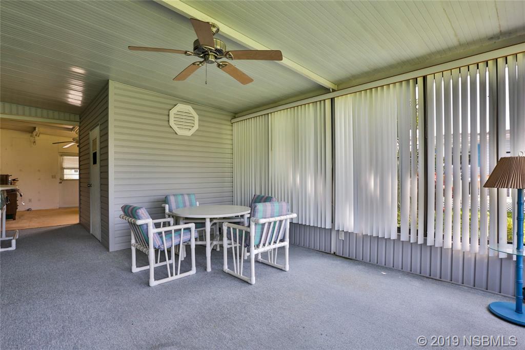 720 Navigators Way Edgewater, FL 32141 - Photo 26 of 35 a dining room with furniture and window