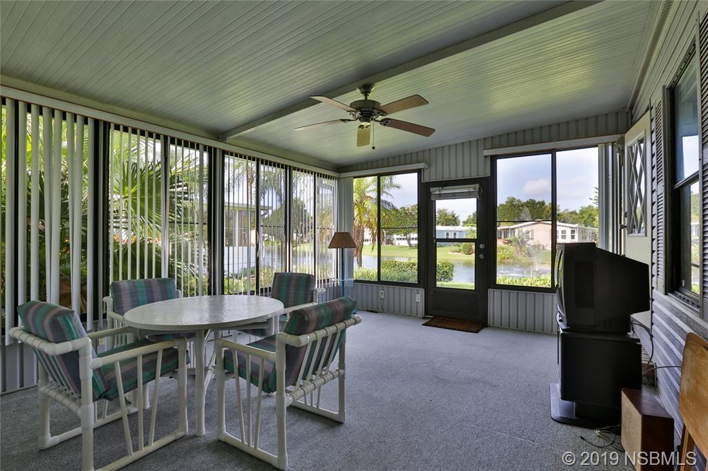 720 Navigators Way Edgewater, FL 32141 - Photo 29 of 35 a view of a dining room with furniture window and outside view