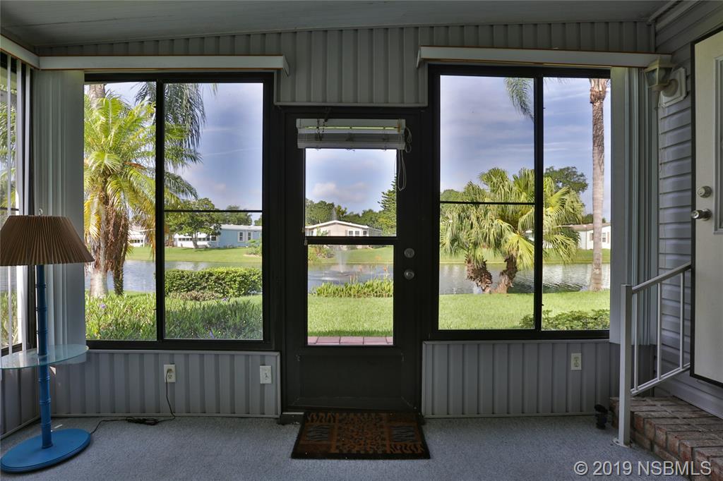 720 Navigators Way Edgewater, FL 32141 - Photo 30 of 35 a room with furniture and a window
