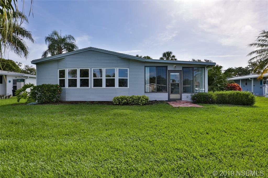 720 Navigators Way Edgewater, FL 32141 - Photo 33 of 35 a view of a house with backyard and garden