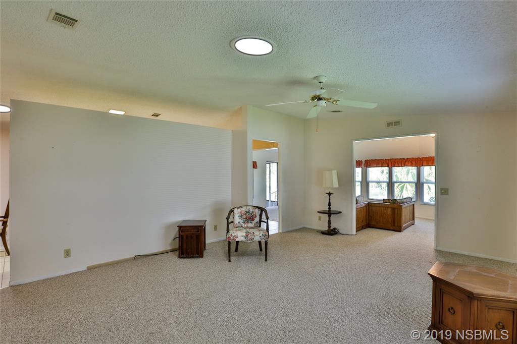 720 Navigators Way Edgewater, FL 32141 - Photo 8 of 35 a living room with furniture