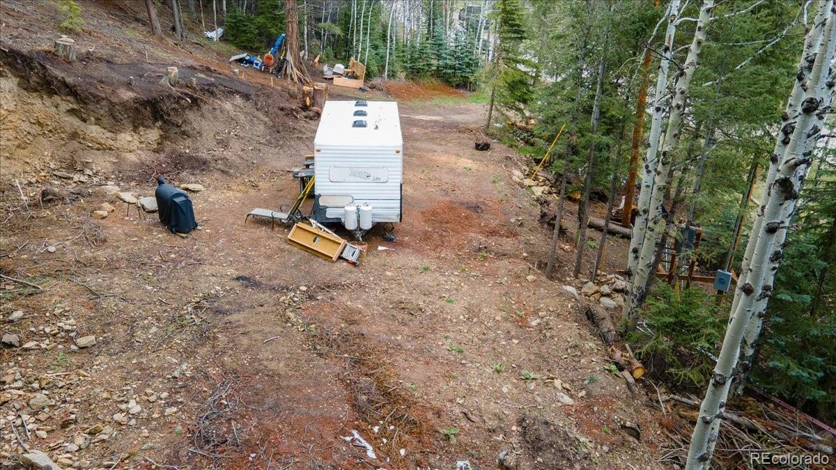 1521 Witter Gulch Road Evergreen, CO 80439 - Photo 17 of 20 a view of outdoor space with seating area