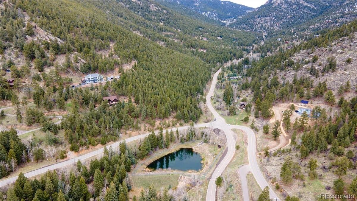 1521 Witter Gulch Road Evergreen, CO 80439 - Photo 4 of 20 a view of balcony with wooden floor