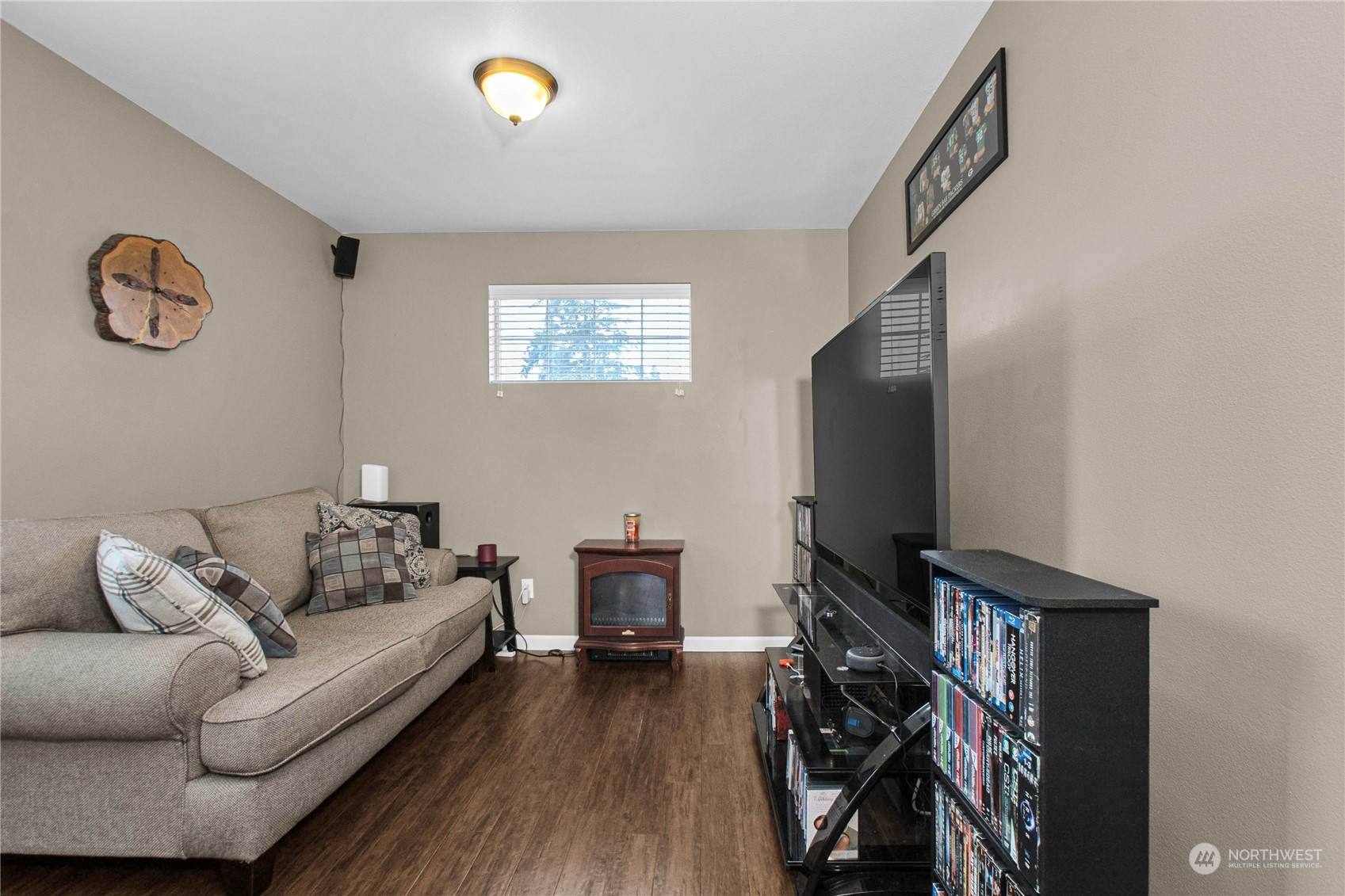 4619 211th Street East Spanaway, WA 98387 - Photo 16 of 36 a living room with furniture and a flat screen tv