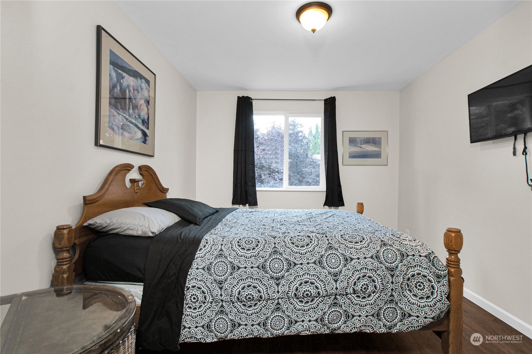 4619 211th Street East Spanaway, WA 98387 - Photo 19 of 36 a bedroom with a bed and window