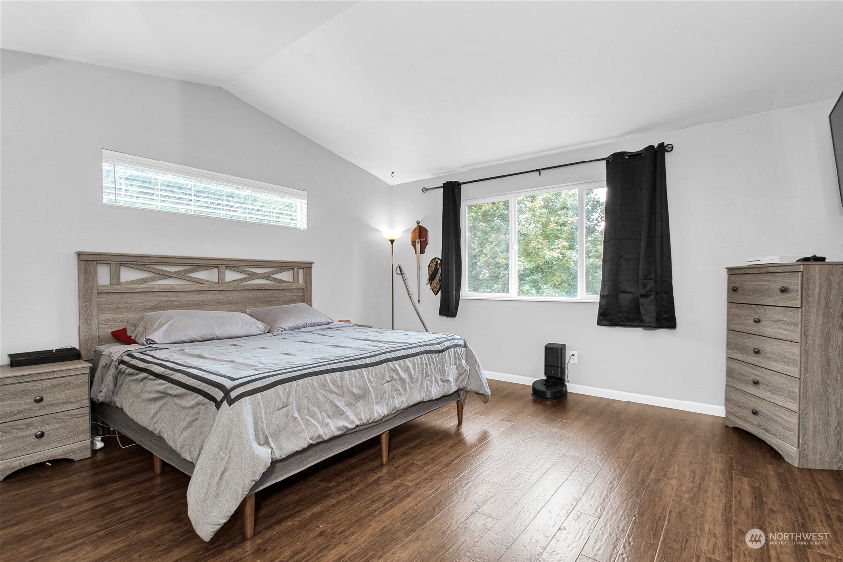 4619 211th Street East Spanaway, WA 98387 - Photo 21 of 36 a bedroom with a bed and a window