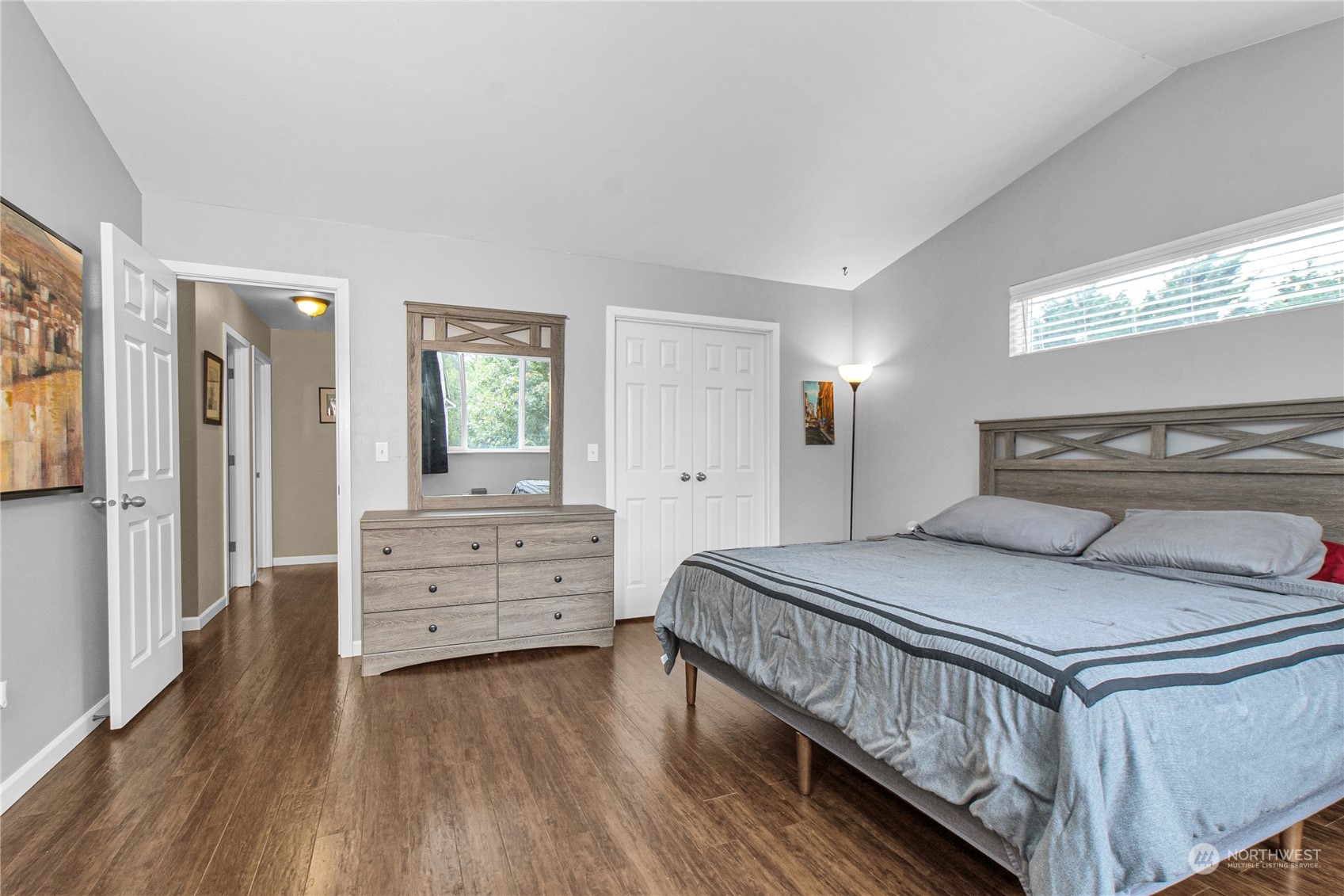 4619 211th Street East Spanaway, WA 98387 - Photo 23 of 36 a bedroom with a bed and a dresser