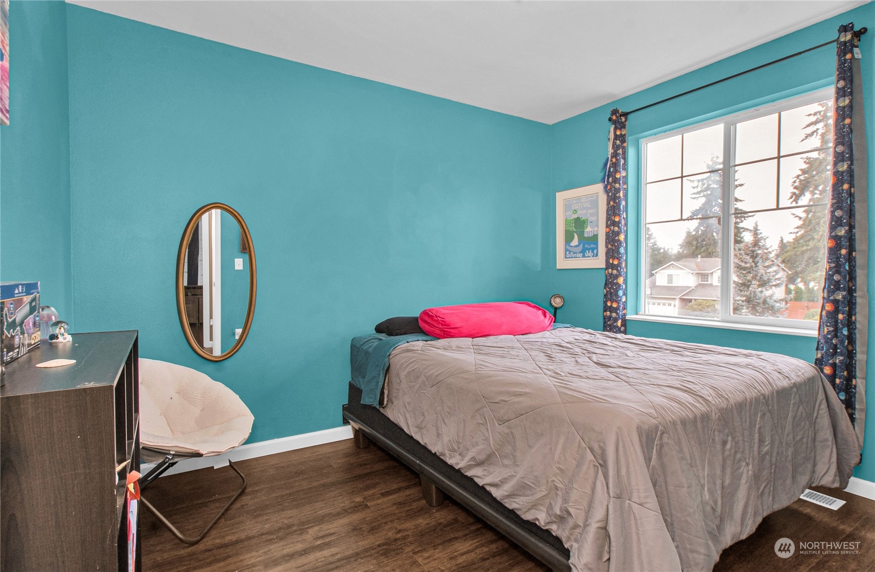 4619 211th Street East Spanaway, WA 98387 - Photo 28 of 36 a bedroom with a bed chair and a large window