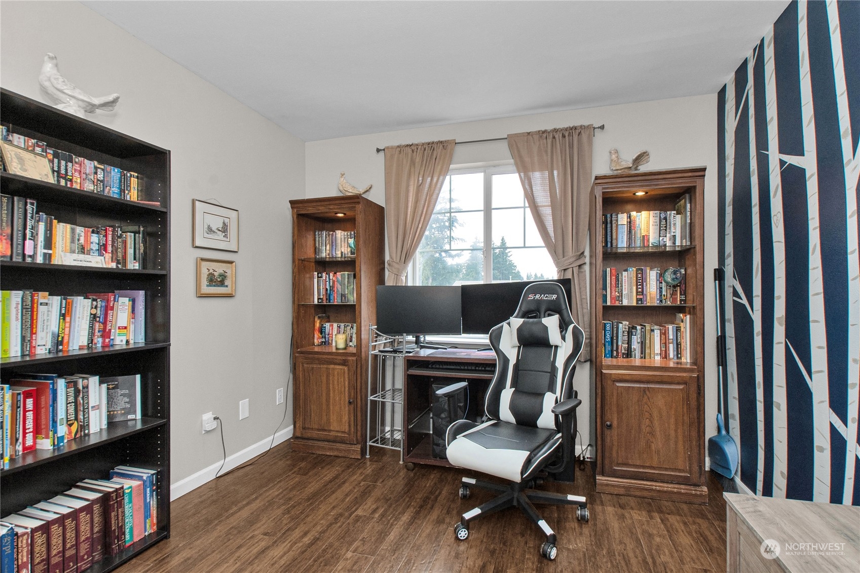 4619 211th Street East Spanaway, WA 98387 - Photo 30 of 36 a workspace with a bookshelf