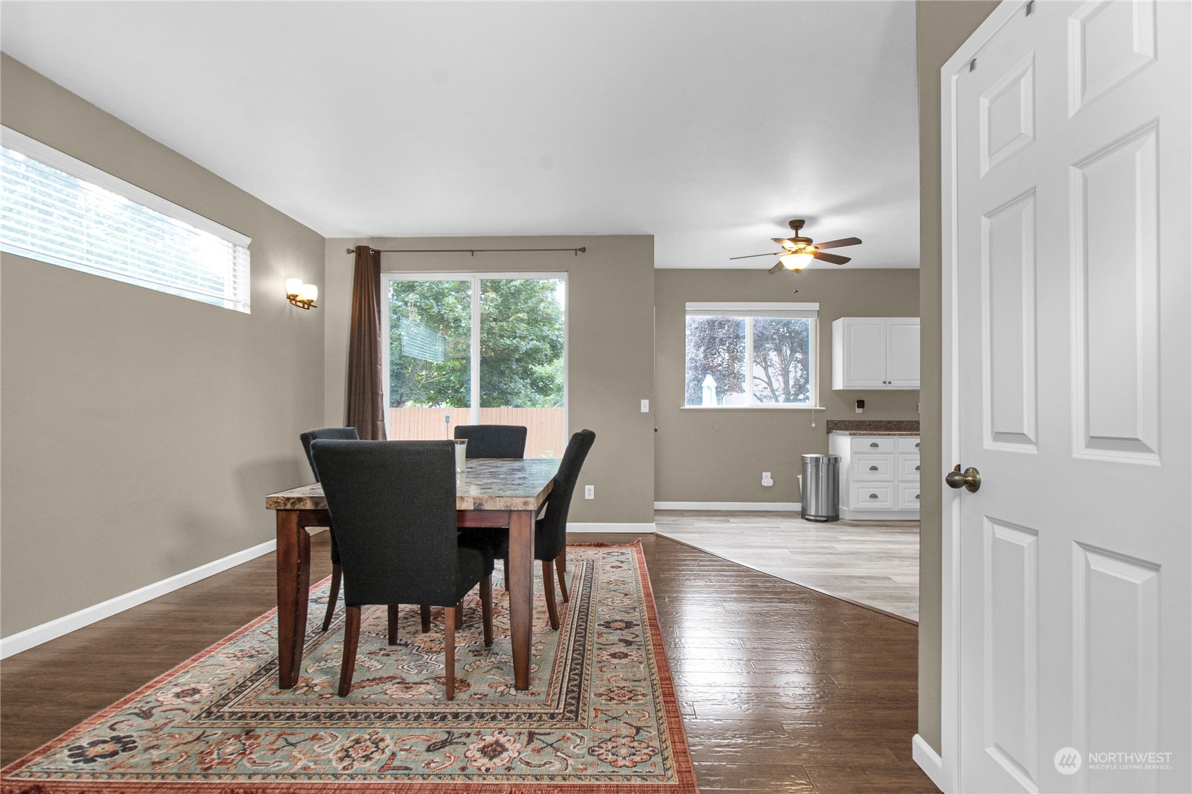 4619 211th Street East Spanaway, WA 98387 - Photo 7 of 36 a view of a dining room with furniture window and wooden floor