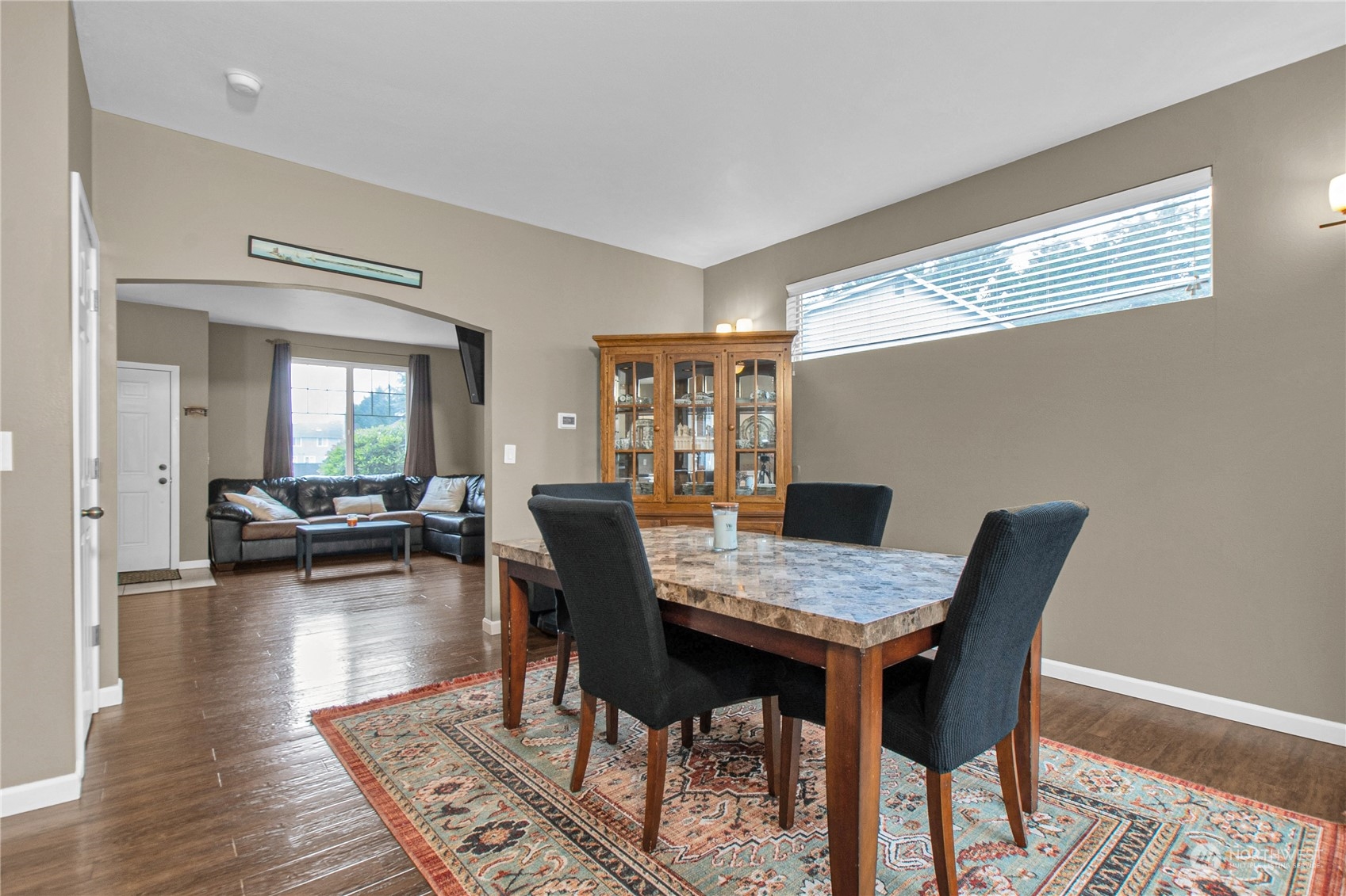 4619 211th Street East Spanaway, WA 98387 - Photo 8 of 36 a view of a dining room with furniture and wooden floor