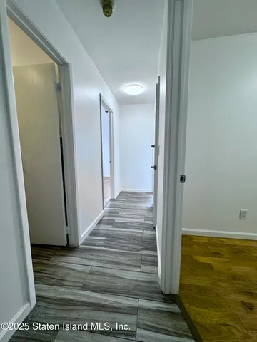a view of entryway with wooden floor
