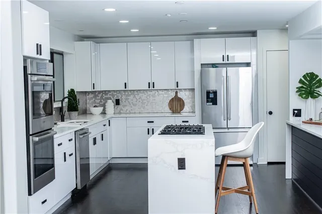a view of a dining room with furniture and a large window