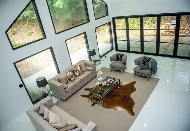 a living room with furniture and a large window