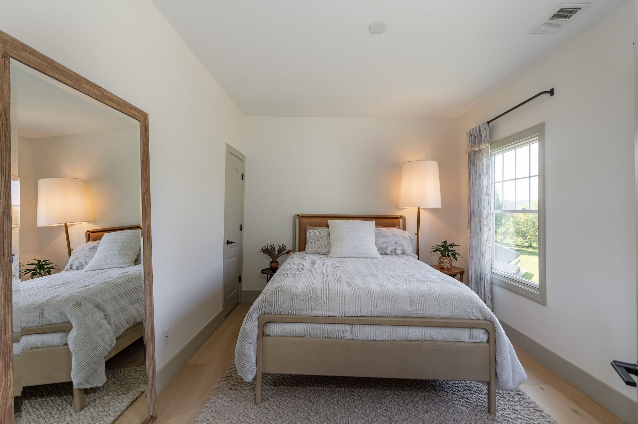 6238 Arno Road Franklin, TN 37064 - Photo 38 of 59 a bedroom with a bed and a lamp