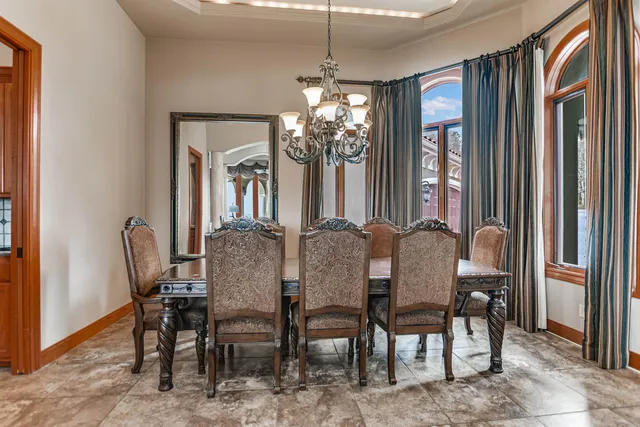 a view of a dining room with furniture and window