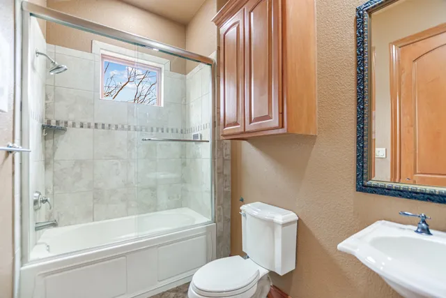 a bathroom with a toilet and a sink