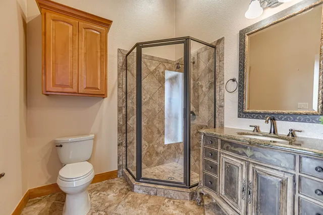 a bathroom with a sink toilet and mirror