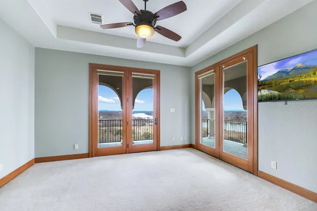 a kitchen with stainless steel appliances granite countertop a sink and dishwasher with white cabinets
