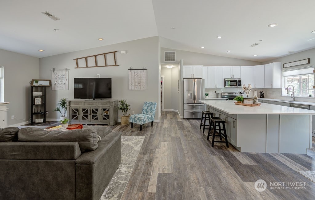 1365 Pitcher Canyon Road Wenatchee, WA 98801 - Photo 13 of 40 a living room with stainless steel appliances furniture and a flat screen tv