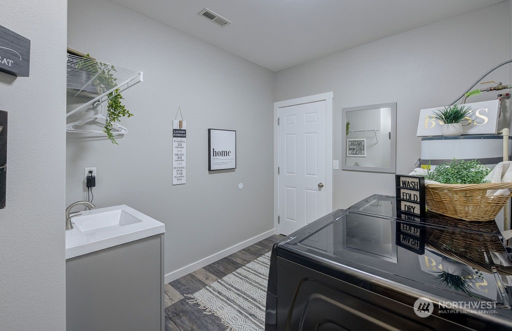 1365 Pitcher Canyon Road Wenatchee, WA 98801 - Photo 18 of 40 a view of kitchen with cabinets and wooden floor
