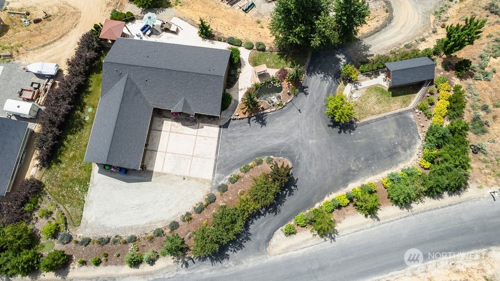 1365 Pitcher Canyon Road Wenatchee, WA 98801 - Photo 2 of 40 an aerial view of a house with a yard and garden