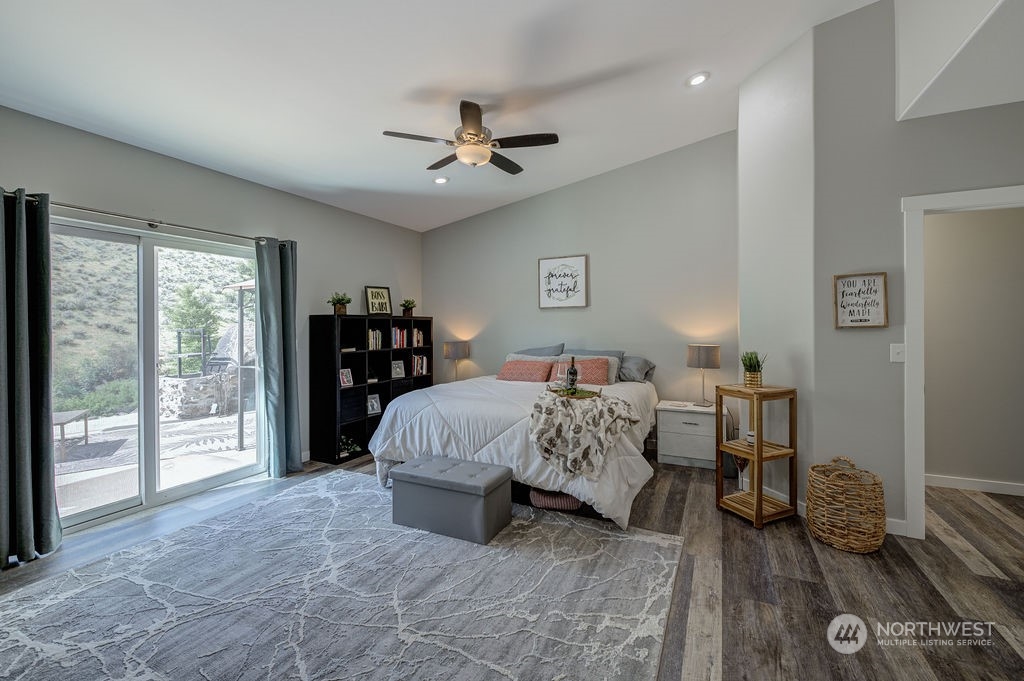 1365 Pitcher Canyon Road Wenatchee, WA 98801 - Photo 22 of 40 a bedroom with a bed and a large window