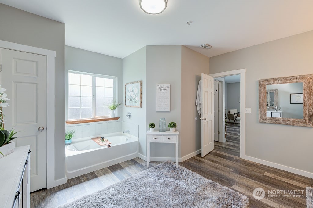 1365 Pitcher Canyon Road Wenatchee, WA 98801 - Photo 23 of 40 a view of a big room with wooden floor and windows