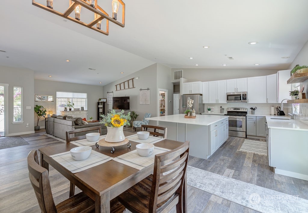 1365 Pitcher Canyon Road Wenatchee, WA 98801 - Photo 7 of 40 a kitchen with a dining table chairs and view of living room