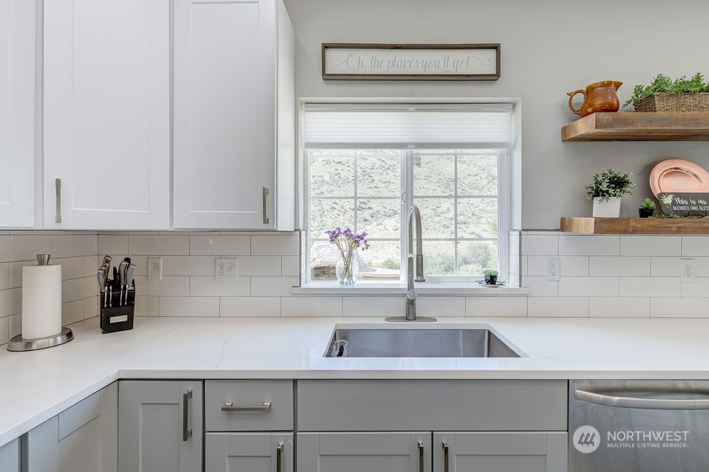 1365 Pitcher Canyon Road Wenatchee, WA 98801 - Photo 10 of 40 a kitchen with a sink cabinets and window