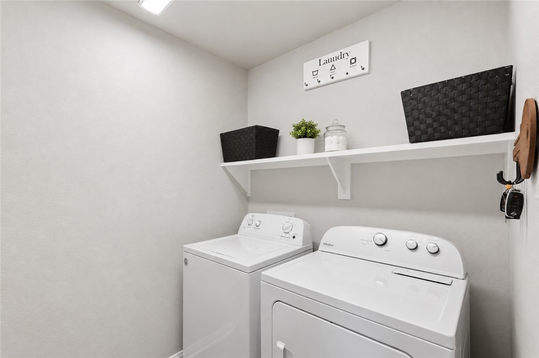 2725 Porter's Way Bryan, TX 77803 - Photo 9 of 19 a utility room with dryer and washer